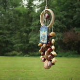 Spring Falls fruit shell wind chime with multicolor natural shells on a woven ring