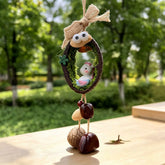 Horse zodiac chime — little white horse with pink and blue mane in a mossy nut shell nest with googly eyes and seed bells