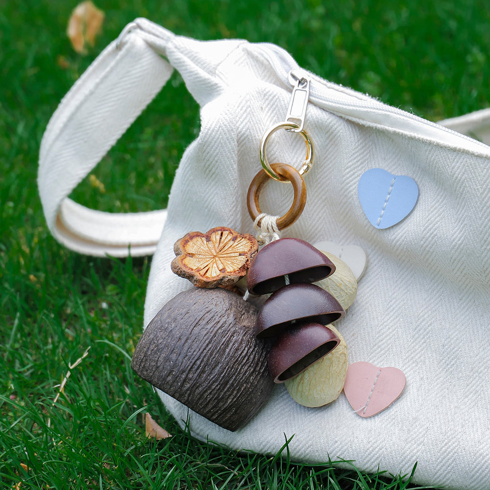 Pastel Day seed charm — soft pastel natural seed bag charm
