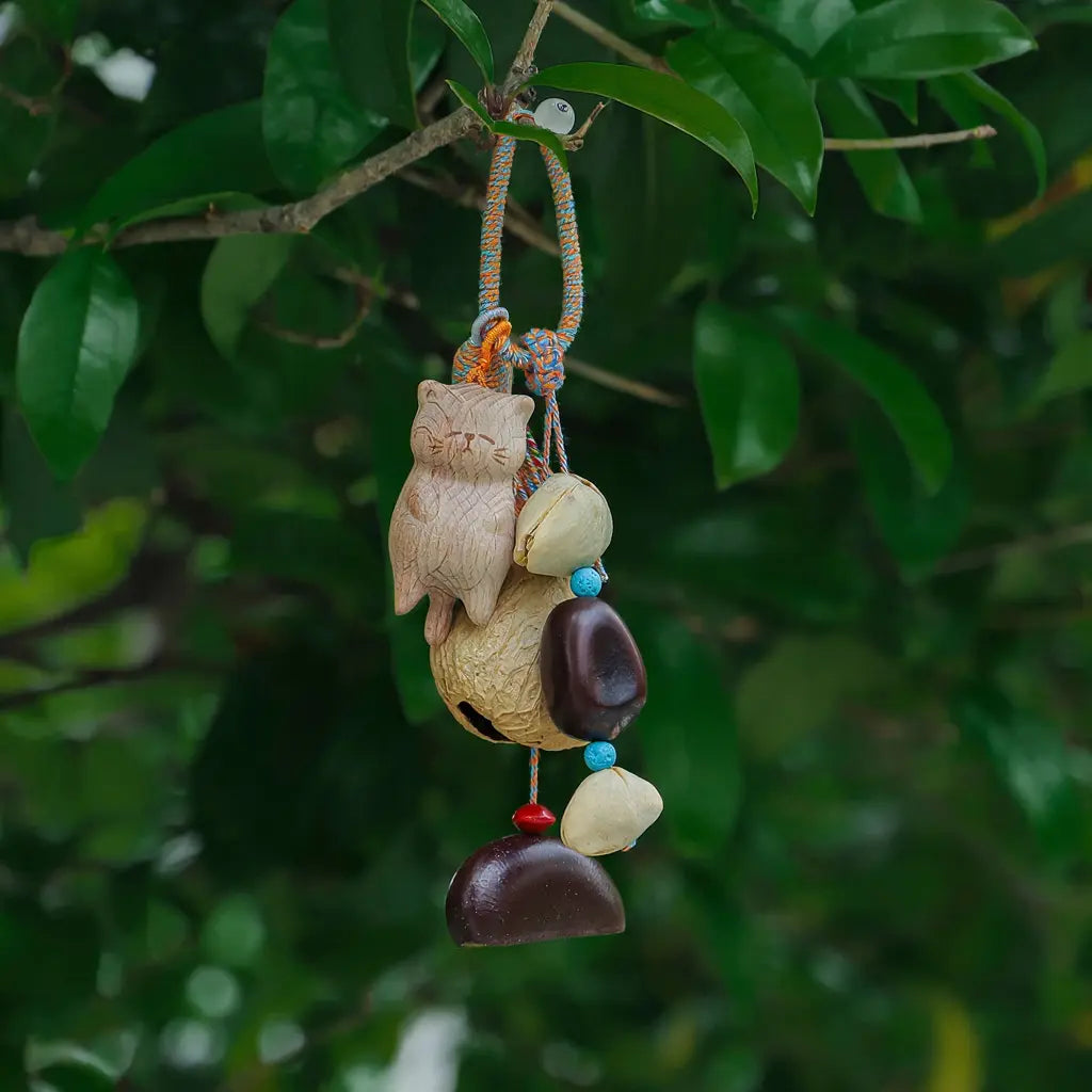 Forest Kitty seed charm — cat-shaped natural seed bell bag charm