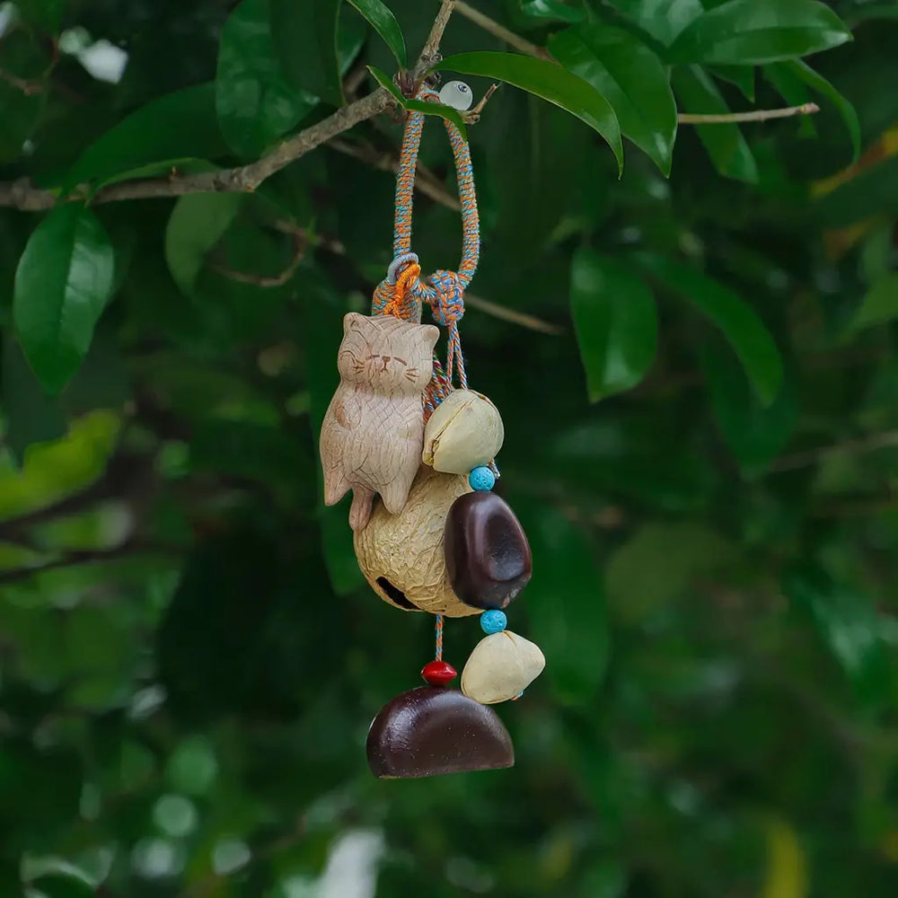 Forest Kitty seed charm — cat-shaped natural seed bell bag charm