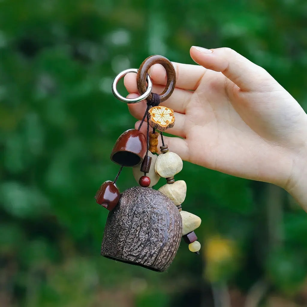 Mountain Berry seed charm — berry-toned natural seed keychain bell