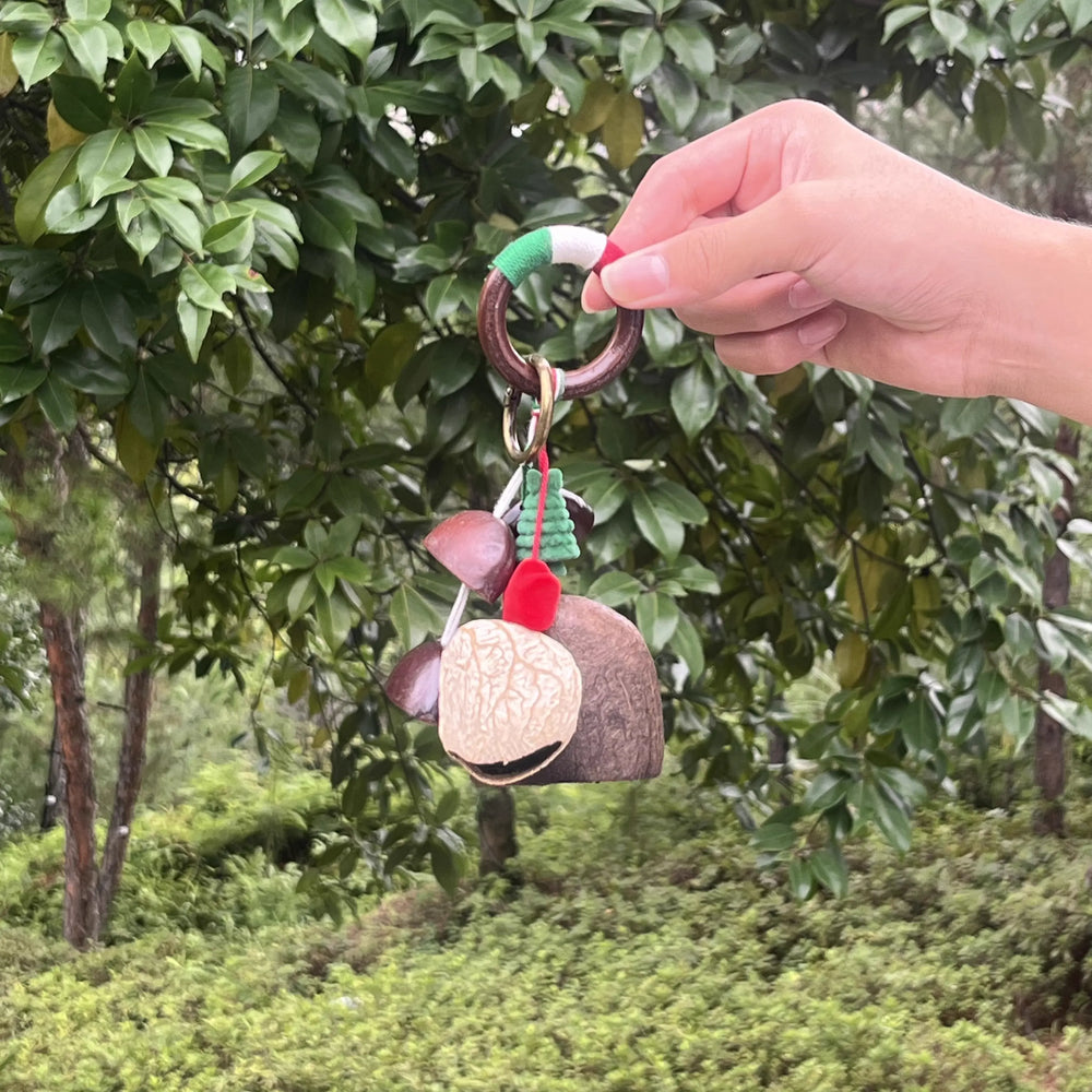 Handmade Winter Forest bag charm with green felt tree, red accents, and multicolor thread wrapping, cozy festive natural charm