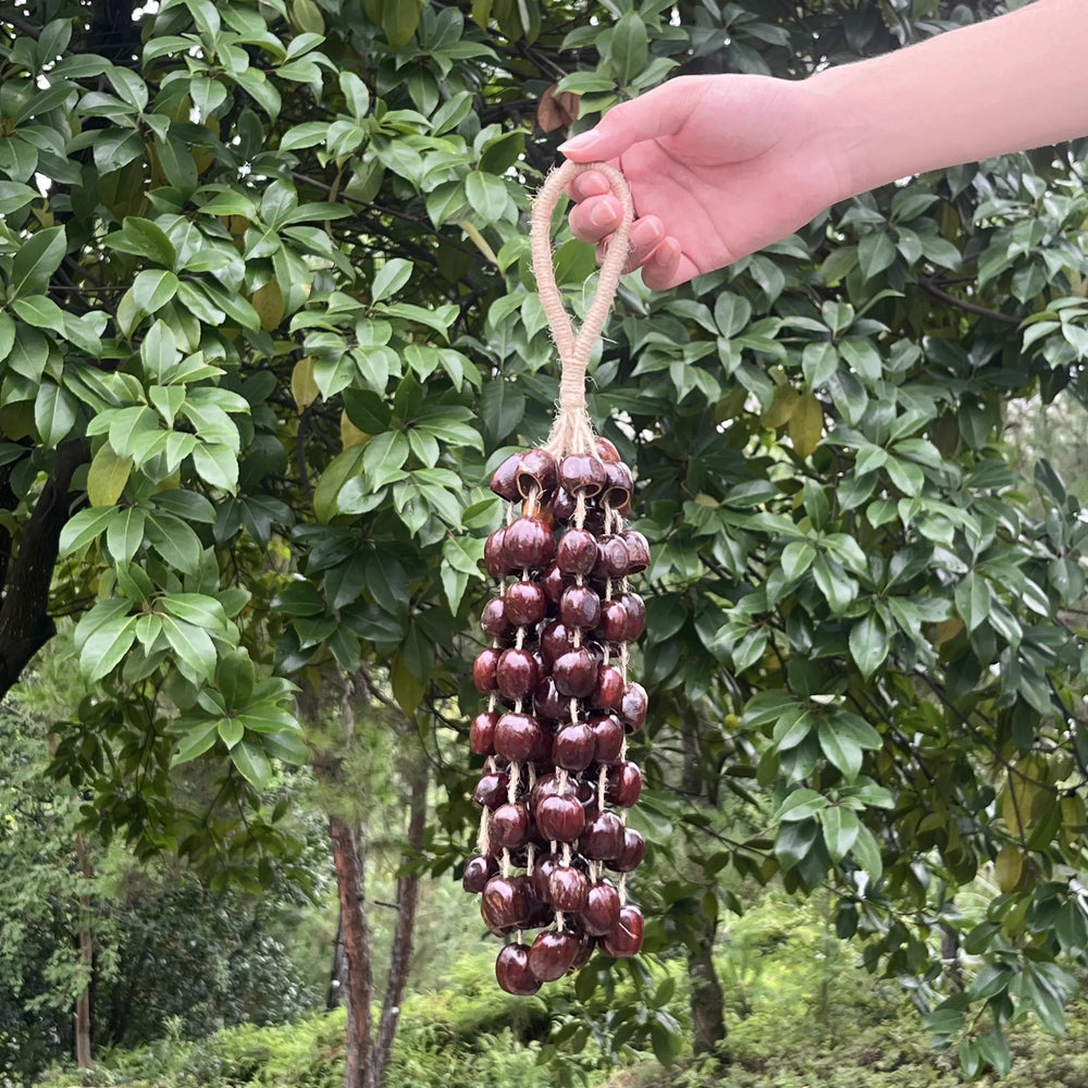 Large Panji 72-seed wind chime hanging on a garden porch, a full-sounding handmade natural centerpiece