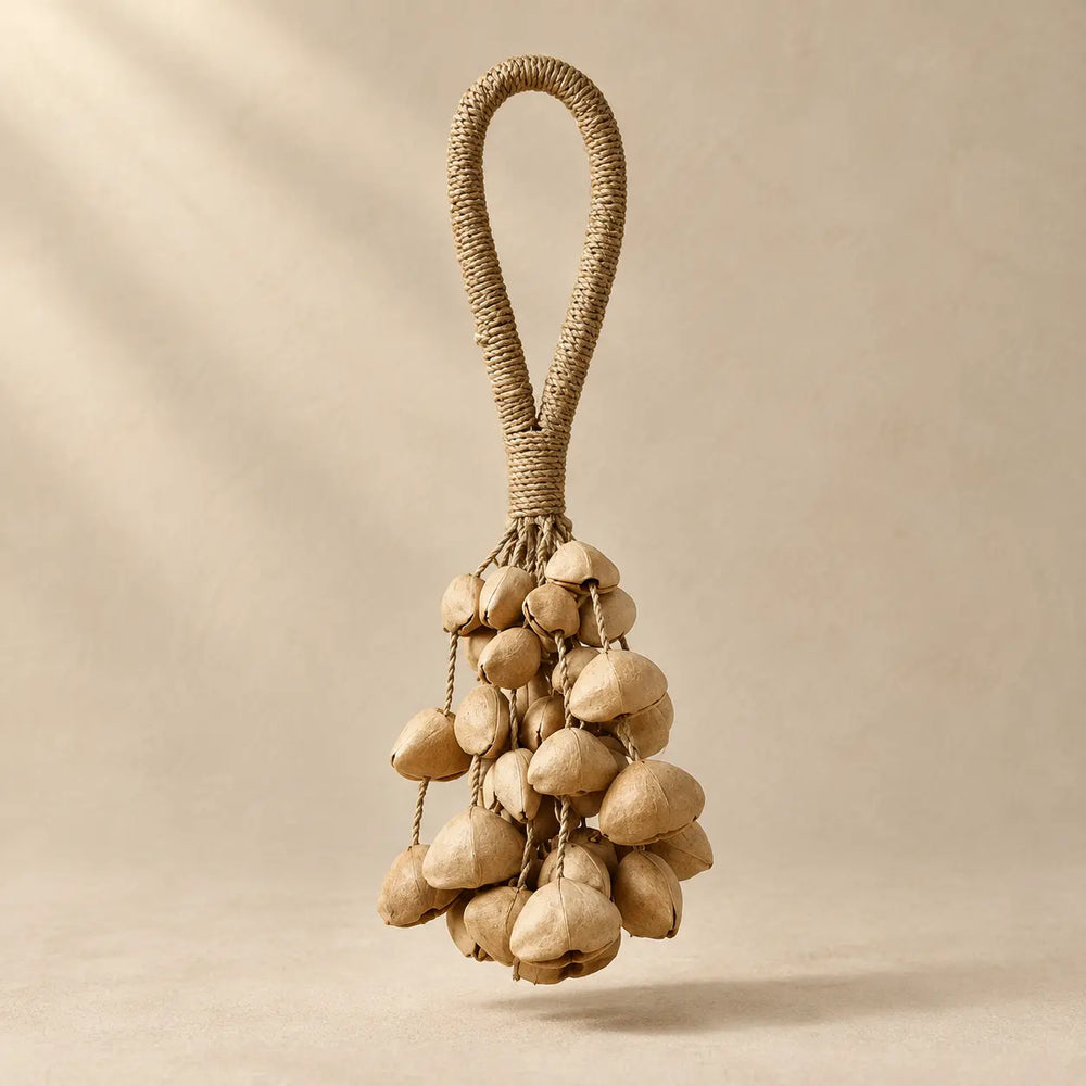 Handmade Chacha seed pod rattle with 42 natural beige pods (14 per strand, three clusters) on a wrapped fiber loop handle, soft shaker sound for meditation