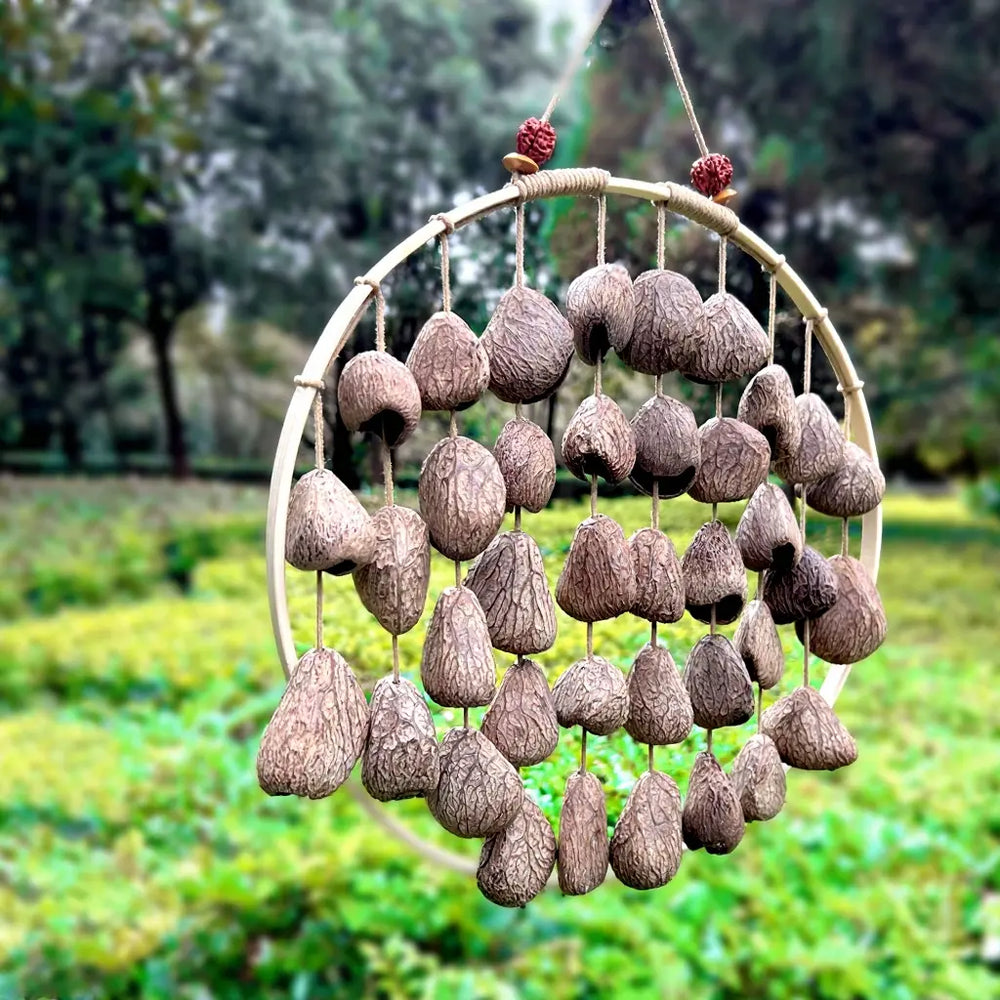 Driftwood Grey fruit shell wind chime with matte textured grey shells