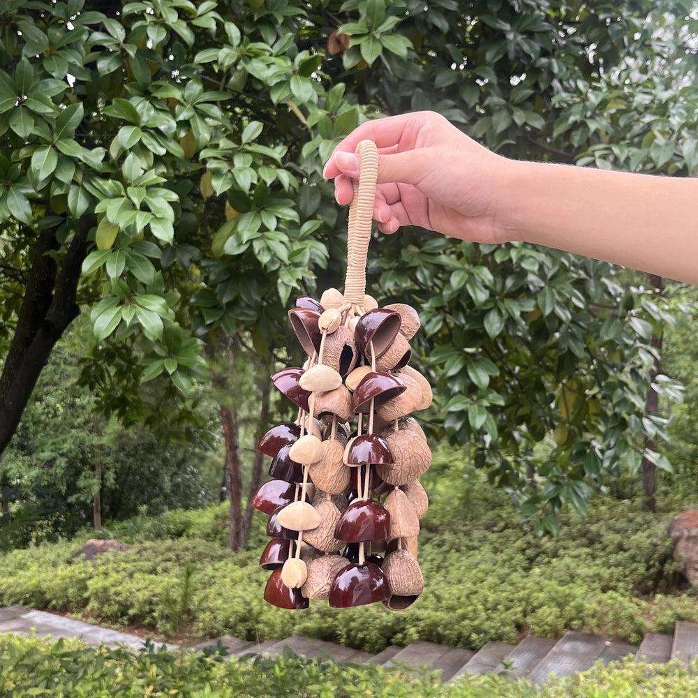 Six-seed blend wind chime in a meditation corner next to a yoga mat, mixing six natural seed sounds