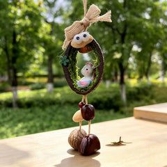 Horse zodiac chime — little white horse with pink and blue mane in a mossy nut shell nest with googly eyes and seed bells