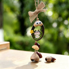 Ox zodiac chime — gentle white and gray ox in a mossy nut shell nest with googly eyes, jute bow and natural seed bells